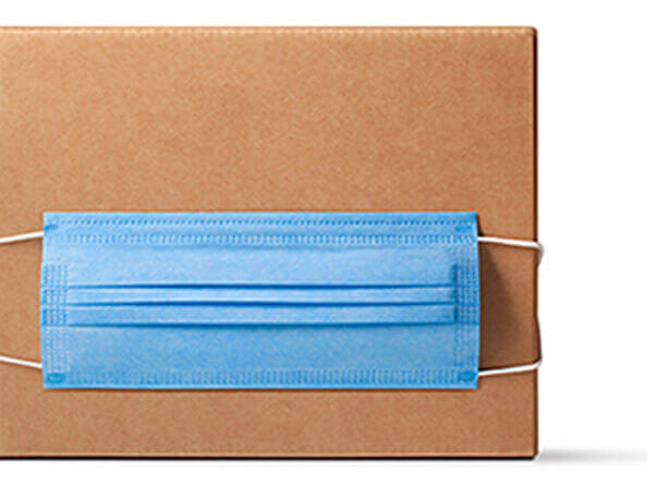 A parcel or package with a PPE mask on it