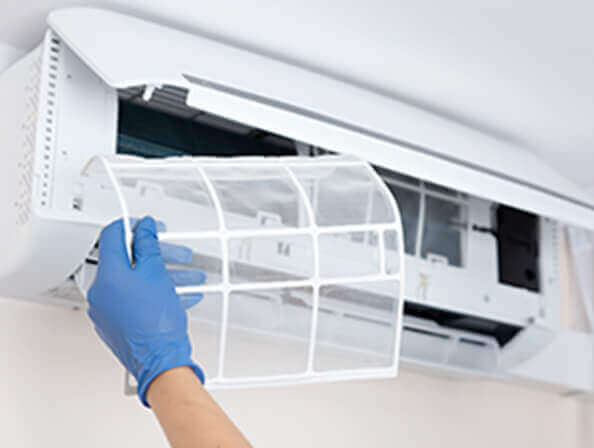 Replacing a filter on home HVAC equipment.
